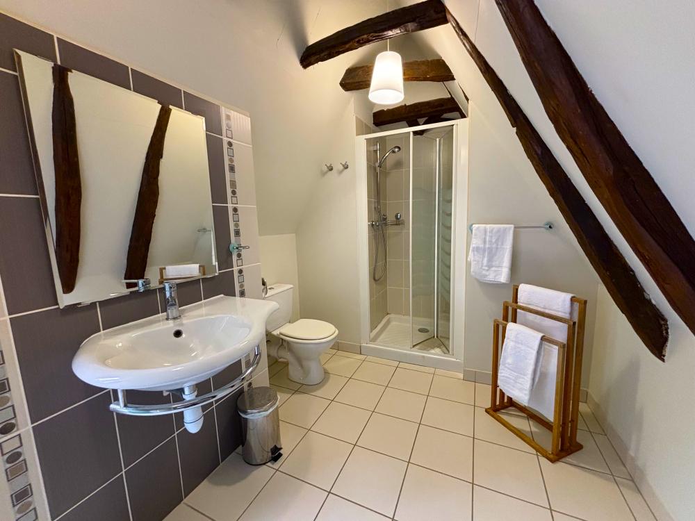 the adjacent large shower room 