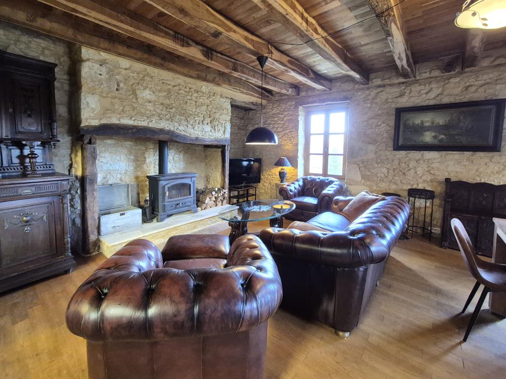 with leather chesterfield sofa and armchairs