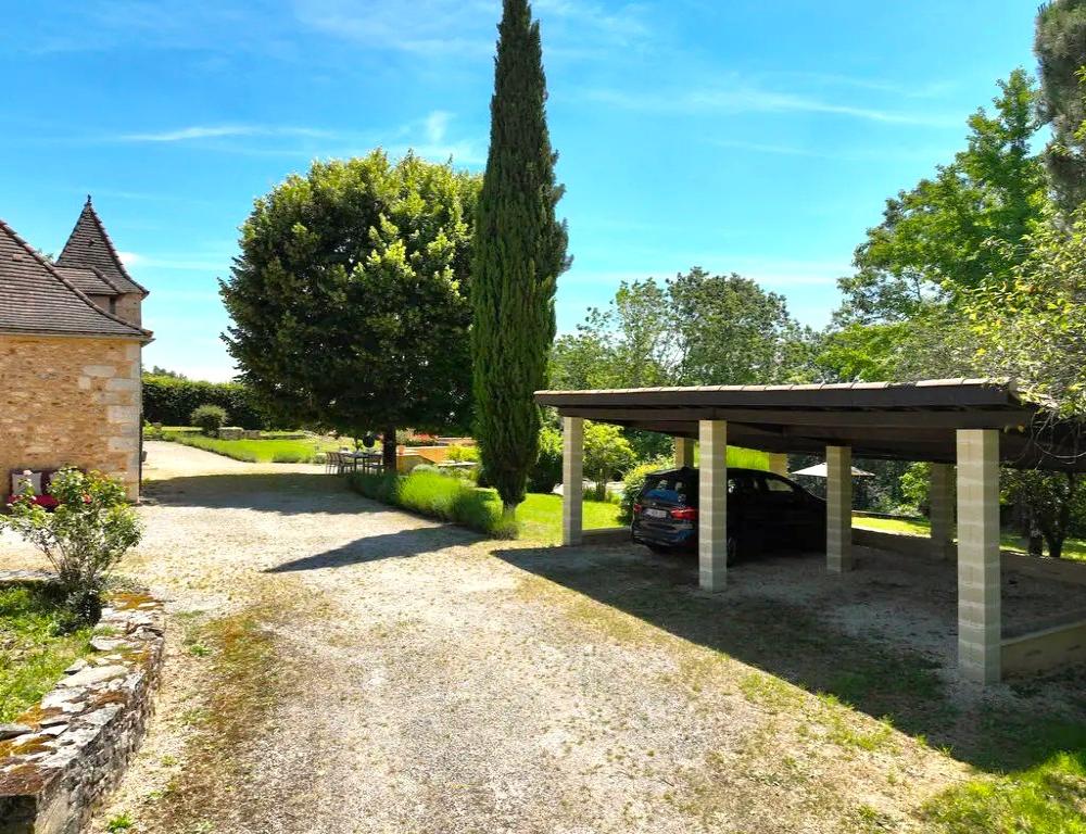 The carrport and parking area 