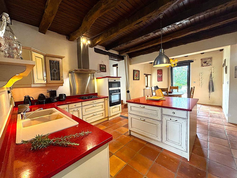 The colored kitchen is perfectly fitted 