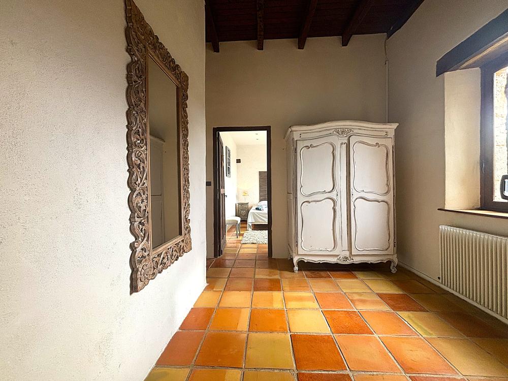 The hall leading to the sleeping area with 2 bedrooms and 1 bathroom