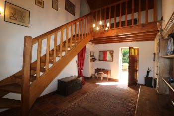 The first sleeping area is set above the entrance hall and living room