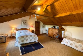 The family bedroom with a double and two single beds 