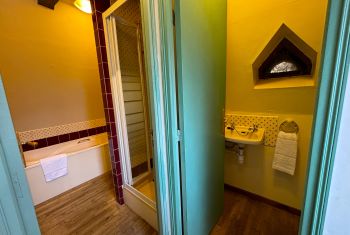 The small adjacent full bathroom 