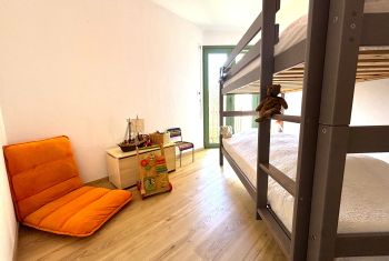 The children bedroom with a bunkbed and toys 