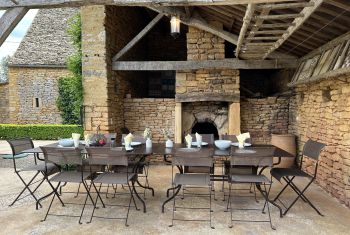 The outdoor dining area is set under the breadoven terrace 