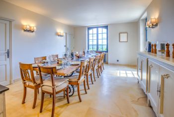 It enjoys a large formal dining table to seat up to 14 guests 