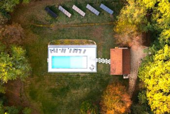 The heated swimming pool and pool house 