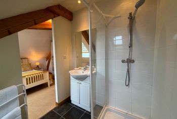 It enjoys a private shower room 