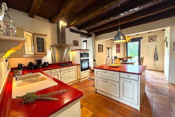 The colored kitchen is perfectly fitted 